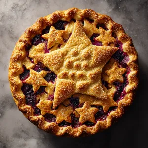 From above, the pie has a deeply golden lattice-style top redesigned into a large elegant π symbol at the center, surrounded by a glossy ring of star-cut vents. The crimped crust is bronzed and sparkling with coarse sugar, while hints of vivid blackberry-blueberry filling peek through for a dramatic cosmic purple-and-gold contrast.