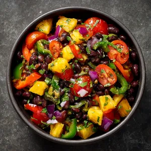 Envision a rainbow-hued bowl with the vivid colors of ripe tomatoes, green bell peppers, deep black beans, and the stunning contrast of bright, juicy pineapple cubes. The sprinkle of a scattering of fresh herbs gives the final touch for a perfect Instagram picture.