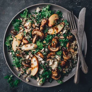 The salad radiates warmth, with golden caramelized apples nestled amidst the earthiness of tossed speckled mushrooms and flecks of hearty grains. The roasted almonds add an appealing depth to the texture, and a shower of fresh parsley breathes color into the plate.