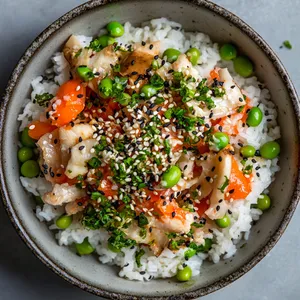 A sight to behold - fluffy white rice specked with vibrant orange crab meat, springy mushrooms, and dots of emerald green edamame. Topped with a sprinkle of black and white sesame, the dish looks like an artwork.